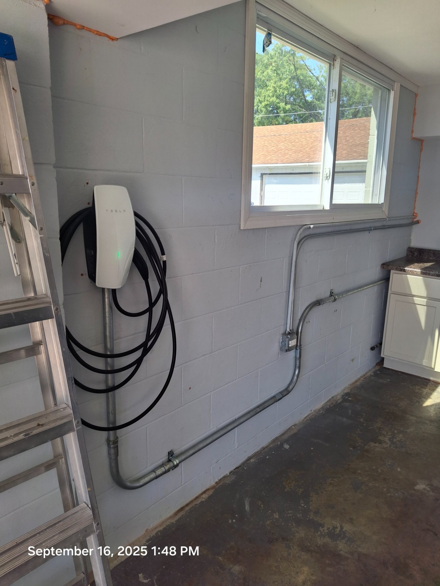Tesla EV charger block wall garage Illinois